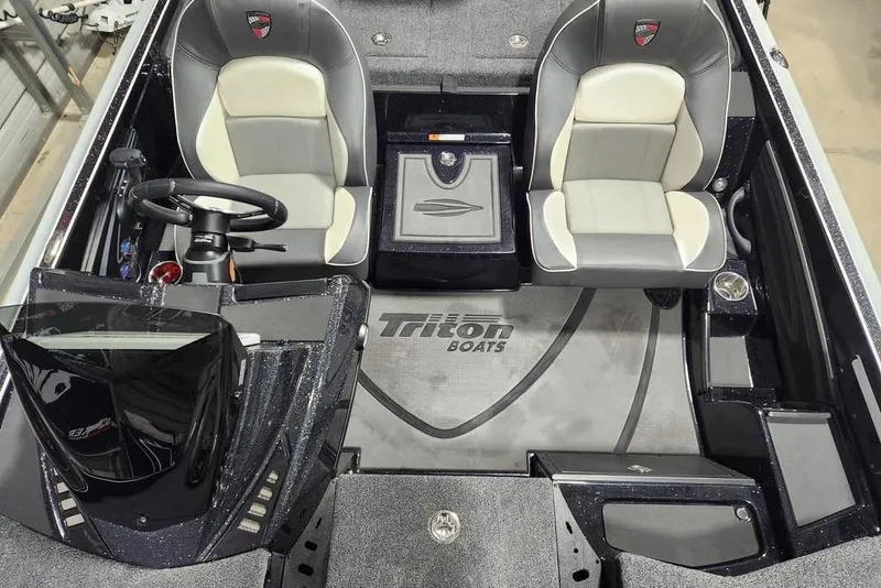 Slide: The Image of 2026 Triton 21XP Patriot boat interior with dual seats and steering console. - 8