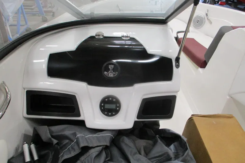 Slide: The Image of 2024 Tahoe 200 S boat dashboard with modern controls and seating. - 10