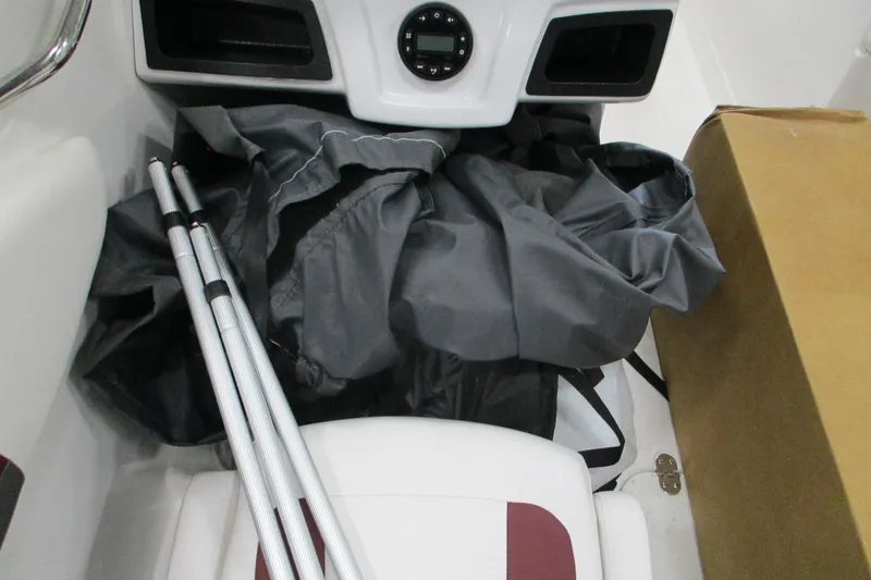 Slide: The Image of Interior of 2024 Tahoe 200 S boat with equipment and storage. - 11