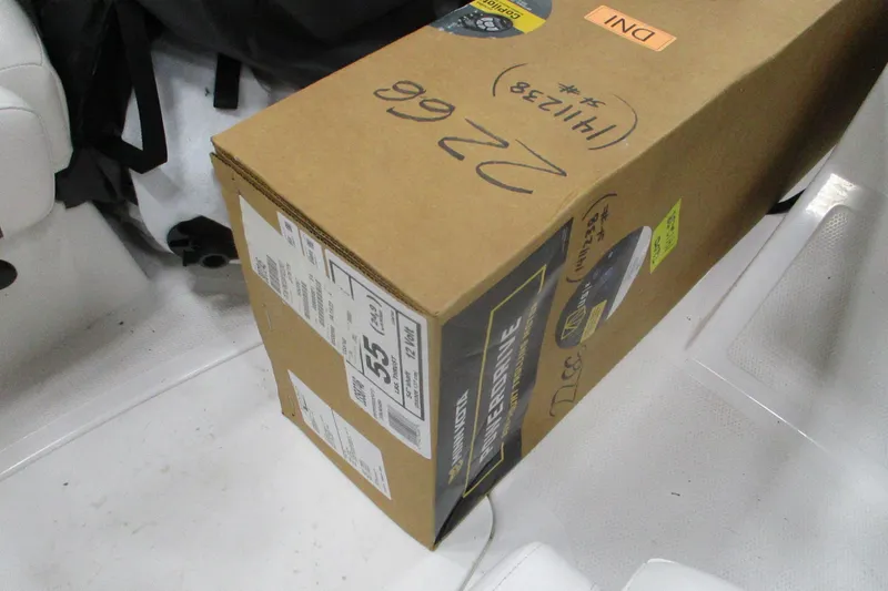 Slide: The Image of Cardboard box labeled "Intershine" inside a 2024 Tahoe 200 S boat interior. - 15