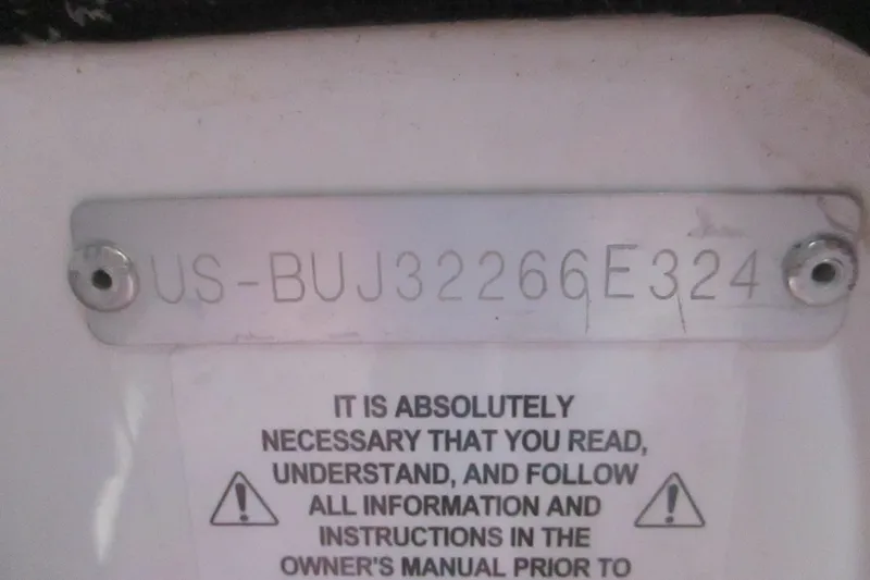 Slide: The Image of 2024 Tahoe 200 S identification plate with warning label. - 2