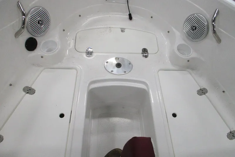 Slide: The Image of Interior view of 2024 Tahoe 200 S boat, featuring storage compartments and speakers. - 6