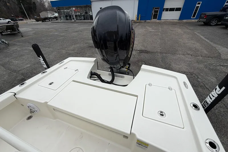 Slide: The Image of 2026 Pathfinder 2200 TRS boat with outboard motor in parking lot. - 22