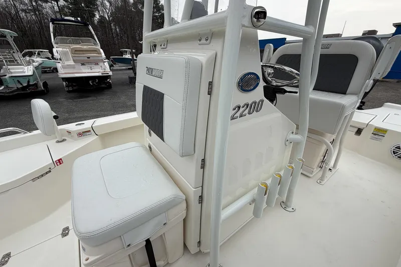 Slide: The Image of 2026 Pathfinder 2200 TRS boat interior with seating and steering console. - 23