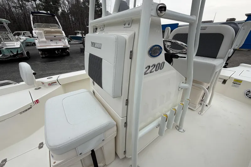 Slide: The Image of 2026 Pathfinder 2200 TRS boat interior with seating and steering console. - 24