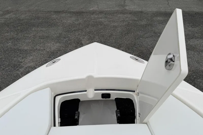 Slide: The Image of 2026 Pathfinder 2200 TRS boat bow with open storage compartment. - 27