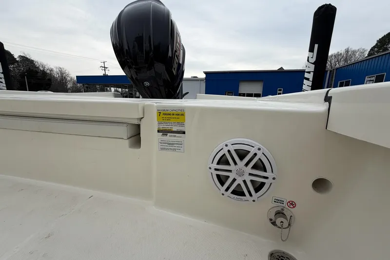 Slide: The Image of 2026 Pathfinder 2200 TRS boat interior with speaker and engine view. - 34