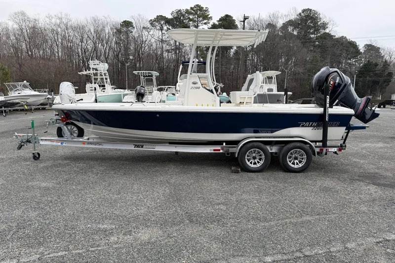 Slide: The Image of 2026 Pathfinder 2200 TRS boat on trailer in outdoor lot. - 7