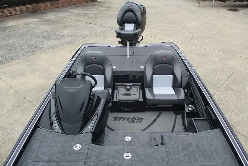 Slide: The Image of 2026 Triton 21XP Patriot boat interior with dual seats and steering console. - 4