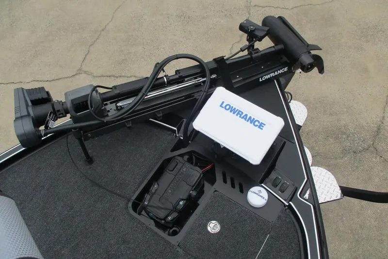 Slide: The Image of Triton 21XP Patriot 2026 boat with Lowrance equipment on deck. - 5