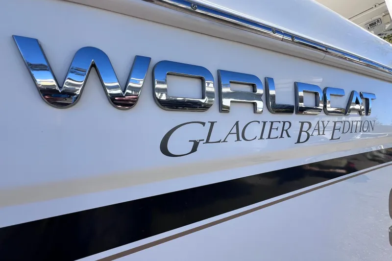 Slide: The Image of 2017 World Cat Glacier Bay Edition 2740 Dual Console boat logo on hull. - 11
