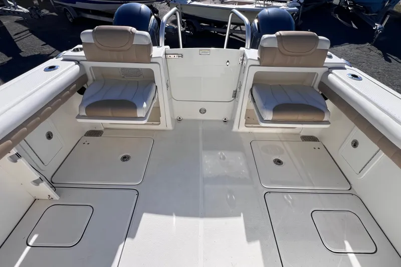 Slide: The Image of 2017 World Cat Glacier Bay Edition 2740 Dual Console boat interior with seating and storage. - 16