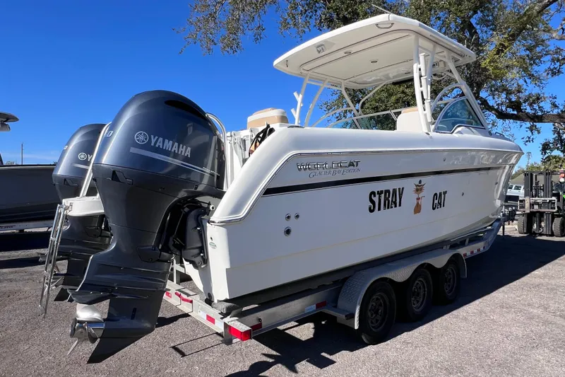 Slide: The Image of 2017 World Cat Glacier Bay Edition 2740 Dual Console boat on trailer with Yamaha engines. - 2