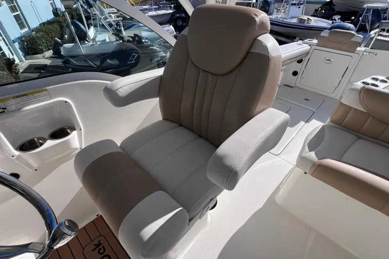 Slide: The Image of Luxurious seating on 2017 World Cat Glacier Bay Edition 2740 Dual Console boat. - 27