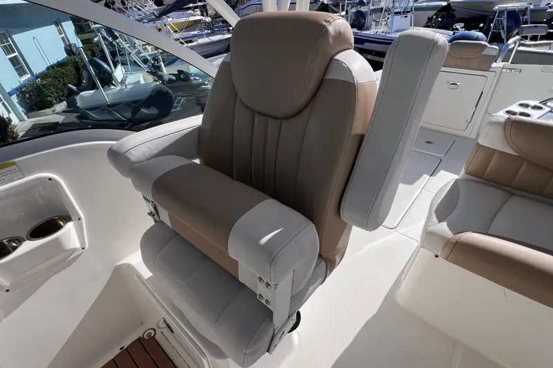 Slide: The Image of 2017 World Cat Glacier Bay Edition 2740 Dual Console boat seat, beige and white upholstery. - 28