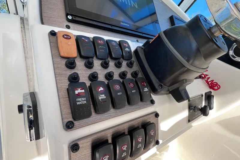 Slide: The Image of Control panel of 2017 World Cat Glacier Bay Edition 2740 Dual Console boat. - 31