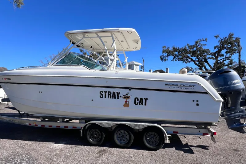 Slide: The Image of 2017 World Cat Glacier Bay Edition 2740 Dual Console boat on trailer, side view. - 4
