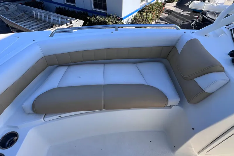 Slide: The Image of 2017 World Cat Glacier Bay Edition 2740 Dual Console boat seating area with beige and white cushions. - 42