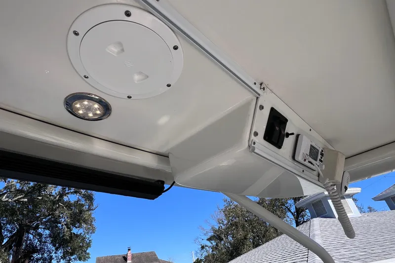 Slide: The Image of 2017 World Cat Glacier Bay Edition 2740 Dual Console boat interior ceiling with light and control panel. - 47