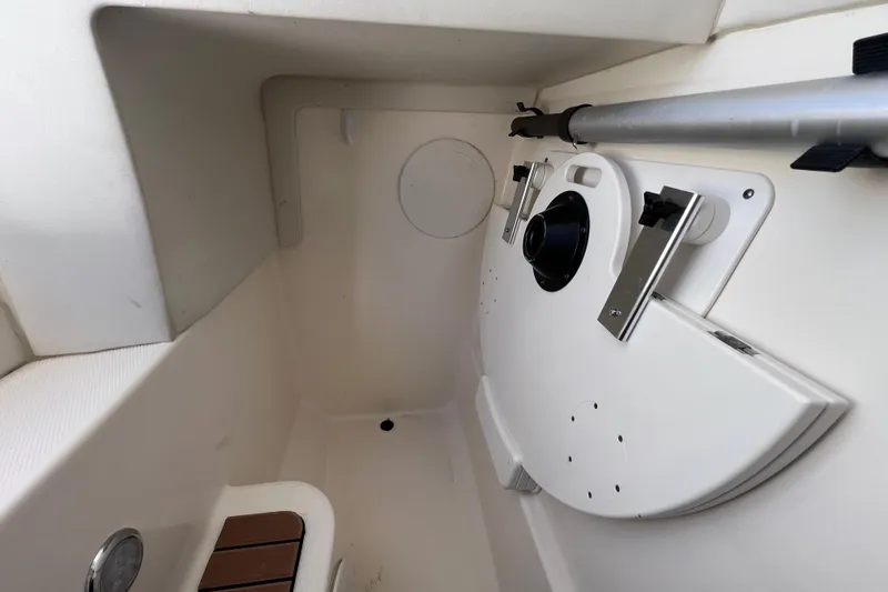 Slide: The Image of 2017 World Cat Glacier Bay Edition 2740 Dual Console interior storage compartment. - 54