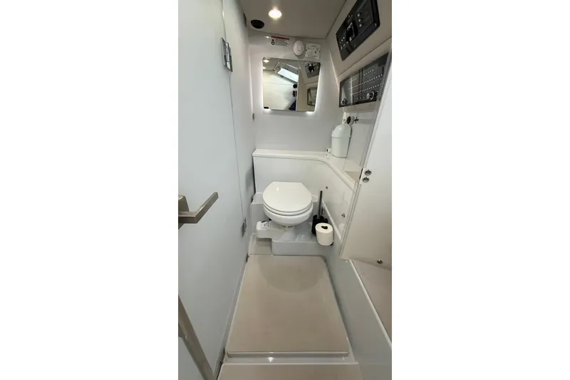 Slide: The Image of 2025 Axopar 37 XC Cross Cabin bathroom with modern fixtures and compact design. - 6