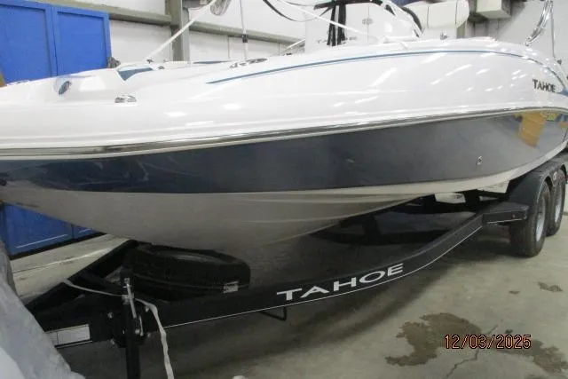 Slide: The Image of 2024 Tahoe 2150 CC boat on trailer in indoor storage facility. - 1