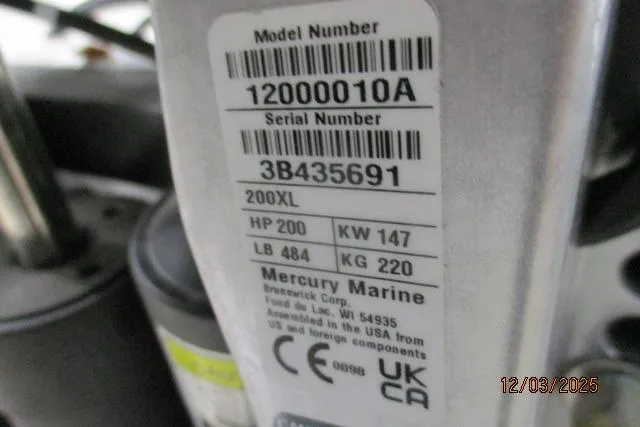 Slide: The Image of Label on Mercury Marine engine, model 200XL, showing specifications and serial number. - 10