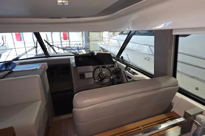 Slide: The Image of Interior view of 2020 Tiara Yachts F44 Flybridge helm station with modern controls. - 30