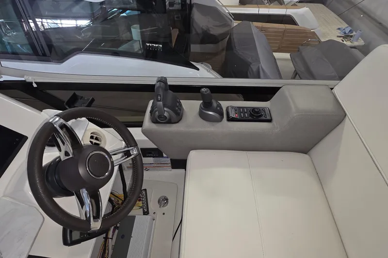 Slide: The Image of Interior helm of 2020 Tiara Yachts F44 Flybridge with steering wheel and controls. - 33