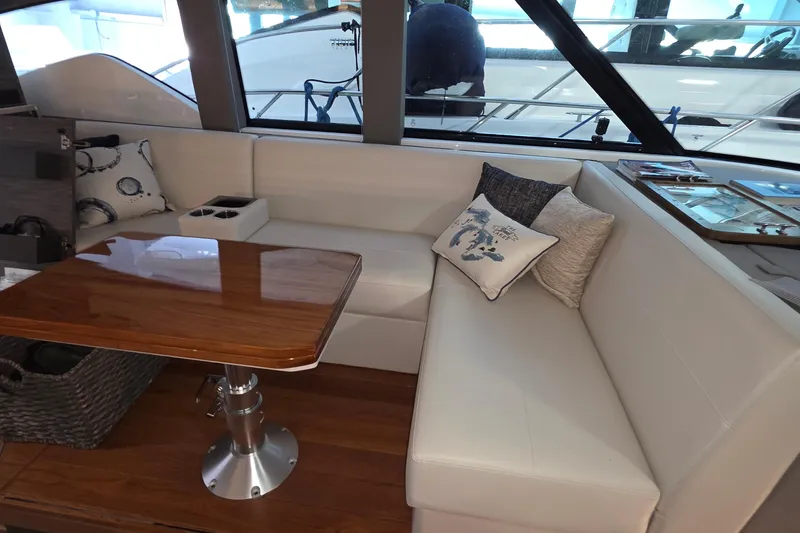 Slide: The Image of Luxurious interior of 2020 Tiara Yachts F44 Flybridge with elegant seating and wooden table. - 35