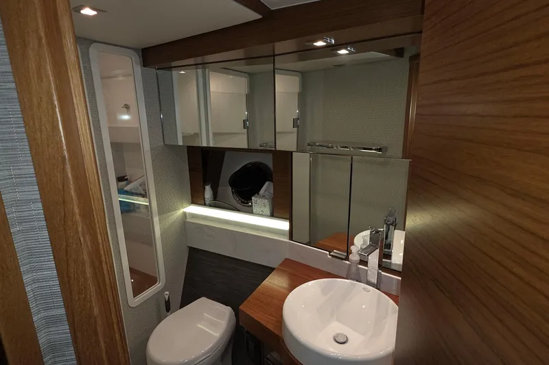 Slide: The Image of Luxurious bathroom in 2020 Tiara Yachts F44 Flybridge, featuring modern fixtures and wood accents. - 41