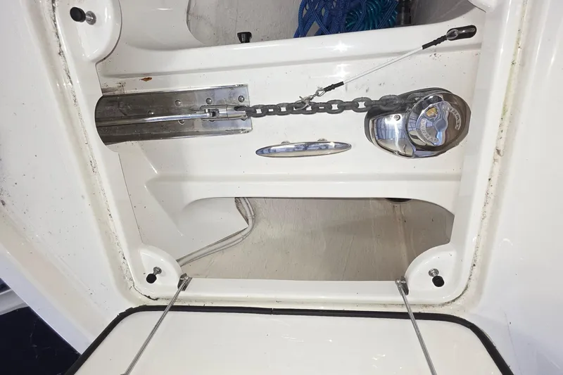Slide: The Image of Anchor chain compartment of 2020 Tiara Yachts F44 Flybridge, featuring a winch system. - 46