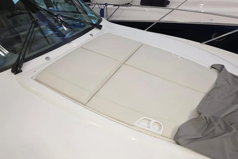 Slide: The Image of 2020 Tiara Yachts F44 Flybridge with cushioned deck area, showcasing luxury design. - 49