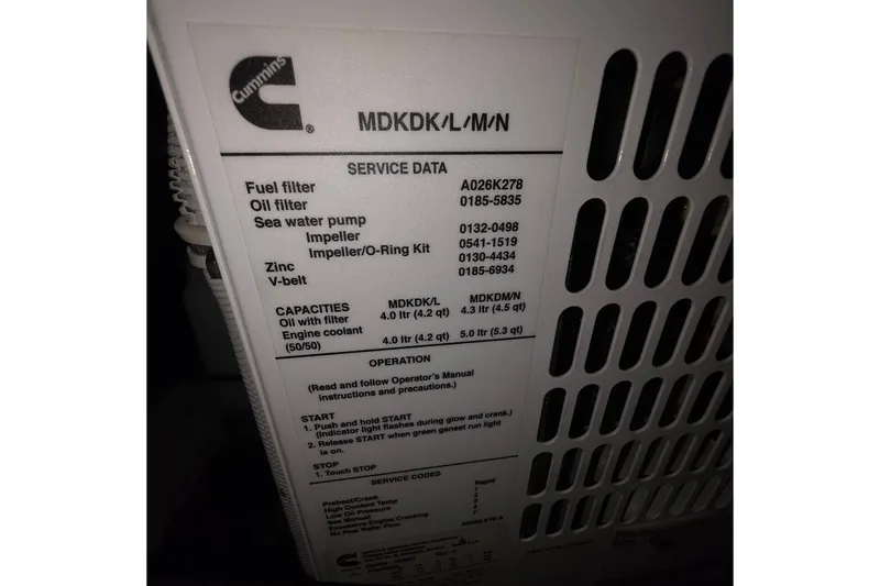 Slide: The Image of Cummins engine service data label on 2020 Tiara Yachts F44 Flybridge. - 52