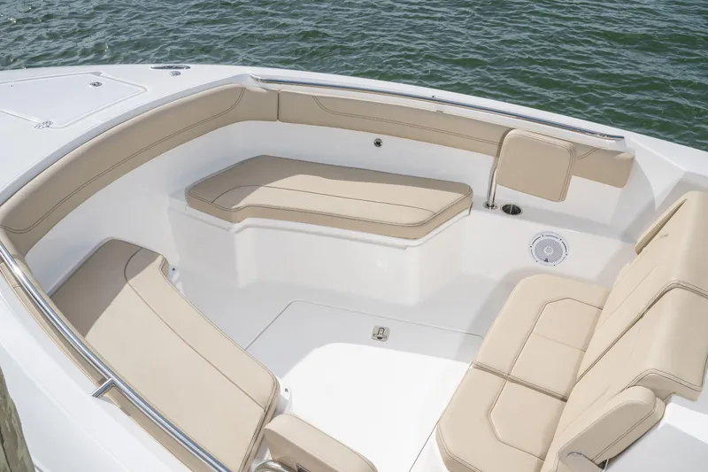 Slide: The Image of Luxurious seating area on 2026 Pursuit S 288 Sport boat, featuring beige cushions and sleek design. - 12