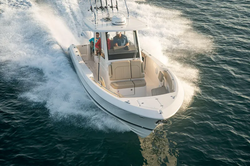 Slide: The Image of 2026 Pursuit S 288 Sport boat cruising on open water, showcasing speed and elegance. - 3