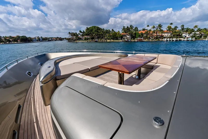Slide: The Image of Luxurious 2013 AB 116 Motoryacht deck with elegant seating and table, overlooking scenic waterfront. - 10