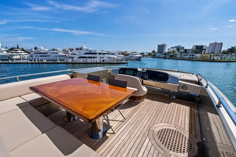 Slide: The Image of Luxurious 2013 AB 116 Motoryacht deck with elegant seating and waterfront view. - 13