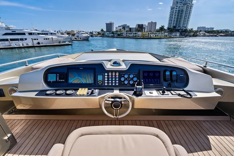 Slide: The Image of Helm of 2013 AB 116 Motoryacht with modern controls, docked in a scenic marina. - 14