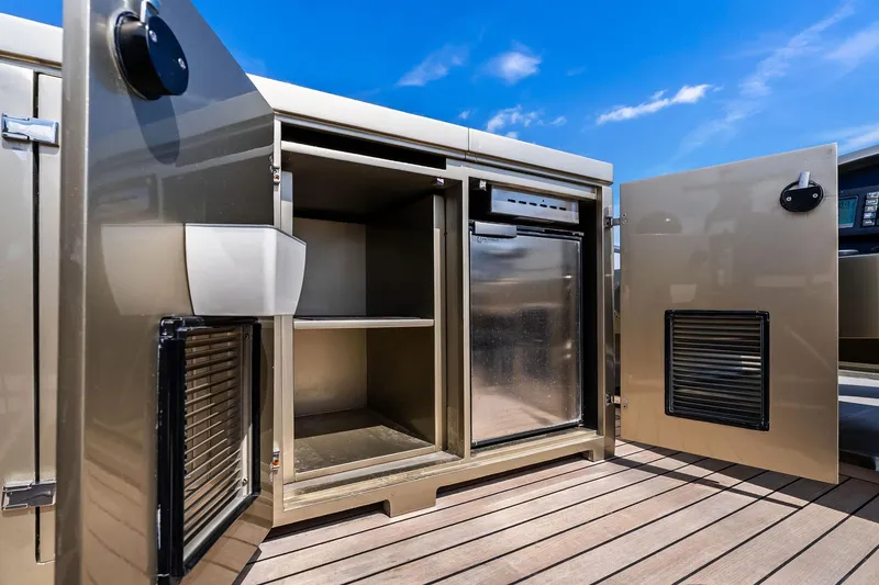 Slide: The Image of Open storage compartments on 2013 AB 116 Motoryacht deck under clear blue sky. - 16