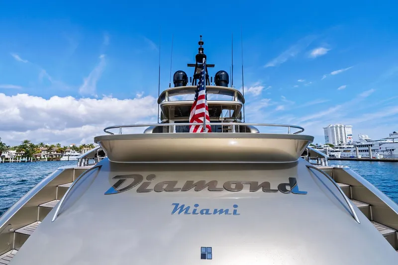 Slide: The Image of Luxury AB 116 Motoryacht 2013, named "Diamond," docked in Miami with American flag. - 23