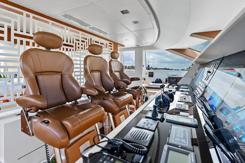 Slide: The Image of Luxurious helm of 2013 AB 116 Motoryacht with leather seats and advanced controls. - 26