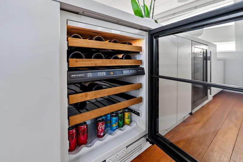 Slide: The Image of Wine cooler with wooden racks and soda cans on AB 116 Motoryacht, 2013 model. - 29