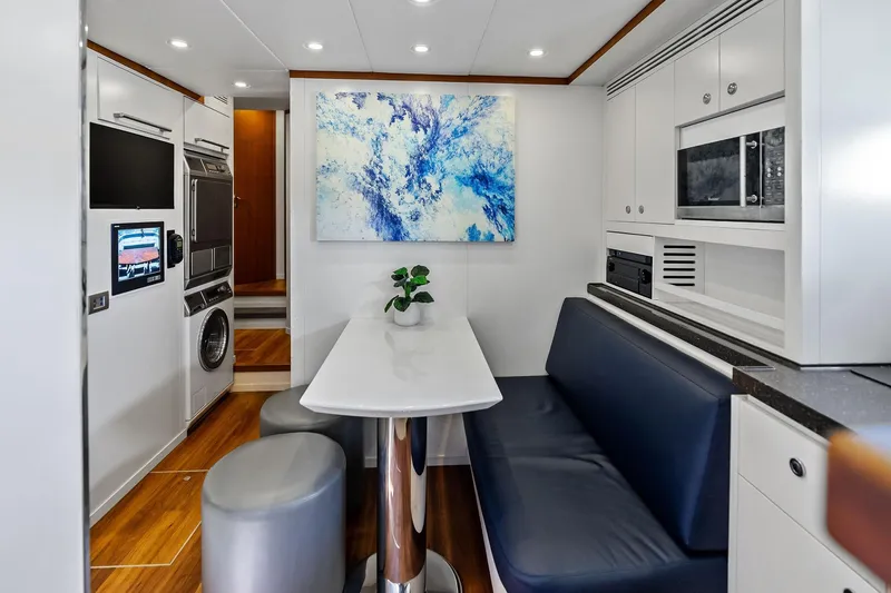 Slide: The Image of Modern interior of 2013 AB 116 Motoryacht with dining area and kitchen amenities. - 33