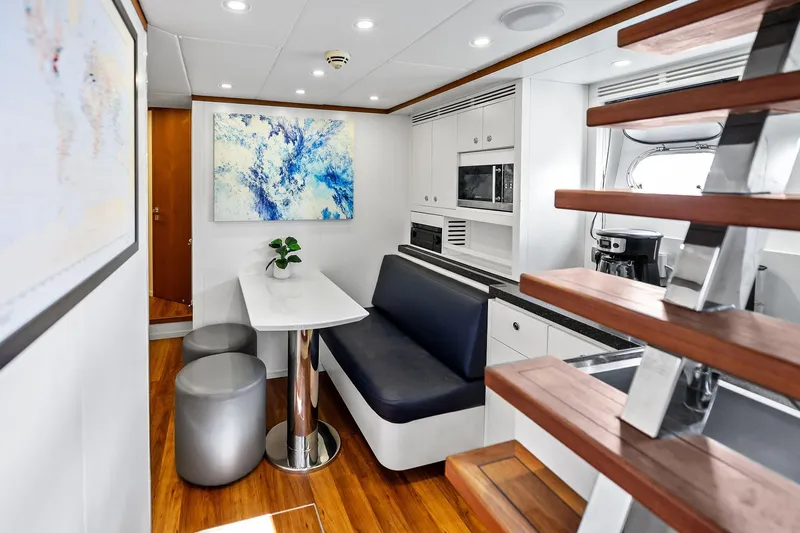 Slide: The Image of Luxurious interior of 2013 AB 116 Motoryacht with modern dining area and staircase. - 34