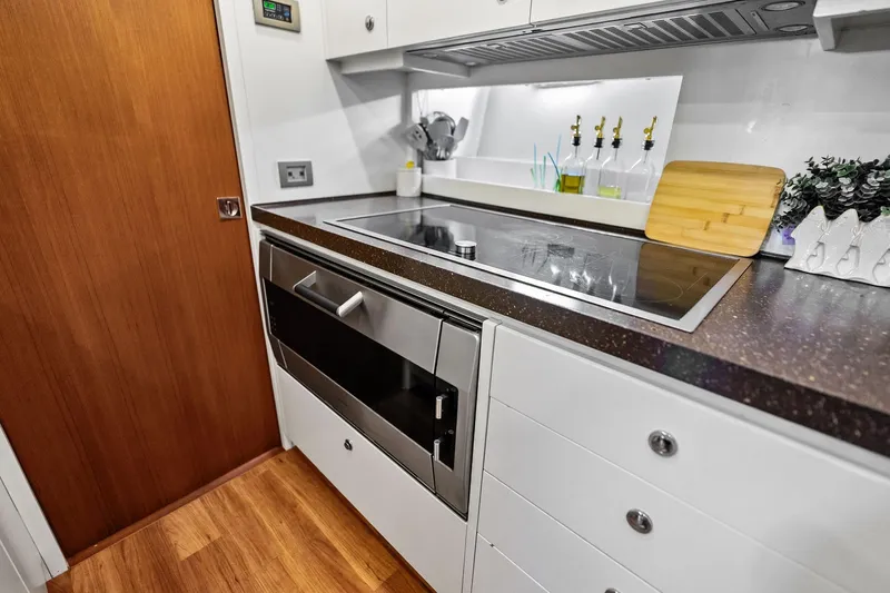 Slide: The Image of Modern kitchen in 2013 AB 116 Motoryacht with sleek appliances and wooden accents. - 39