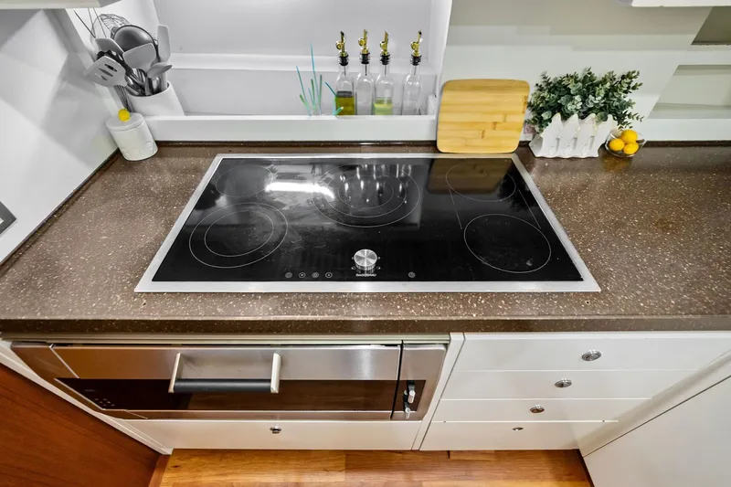 Slide: The Image of Modern kitchen on 2013 AB 116 Motoryacht with sleek stovetop and countertop accessories. - 41