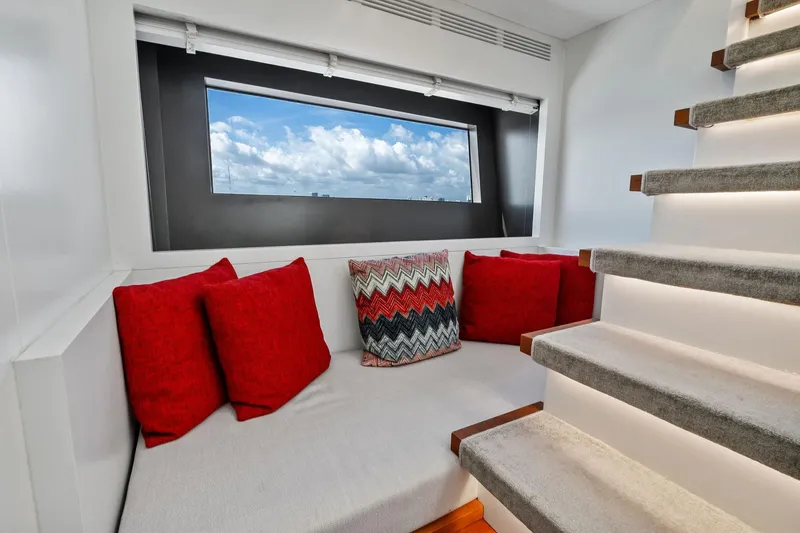 Slide: The Image of Luxurious 2013 AB 116 Motoryacht interior with cozy seating, red cushions, and scenic window view. - 46