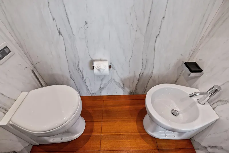 Slide: The Image of Luxurious bathroom on 2013 AB 116 Motoryacht with marble walls and wooden flooring. - 58