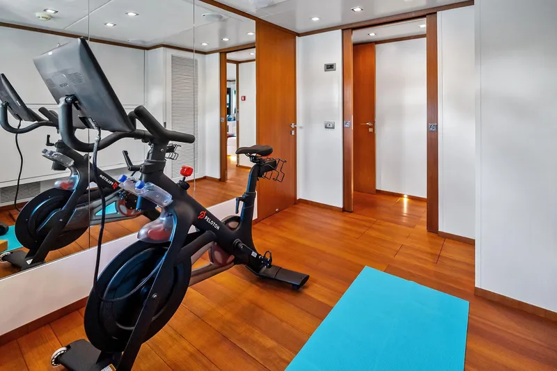 Slide: The Image of Home gym on 2013 AB 116 Motoryacht with Peloton bike and yoga mat. - 60
